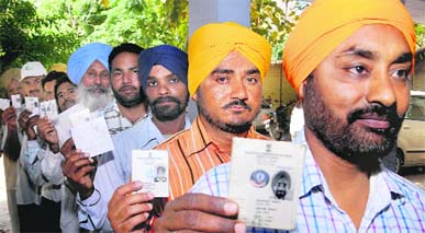 People wait for their turn to cast ballot in Mohali on Wednesday .