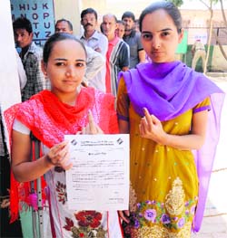 A physically challenged girl, who voted for the first time, shows her appreciation certificate at Jagatpura, Mohali, on Wednesday.