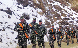 SSB jawans patrol on the Nepal border in Pithoragarh district on Wednesday