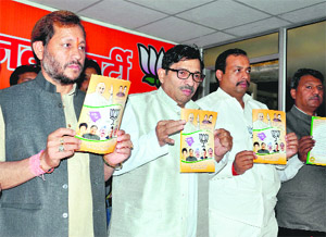 Uttarakhand BJP president Teerath Singh Rawat and other party leaders release a charge-sheet against the Congress government at the partys office in Dehradun on Wednesday.