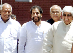 Sirsa MLA Gopal Kanda (centre) comes out of Haryana Raj Bhawan after submitting a letter of withdrawing support from Hooda Government on Wednesday.