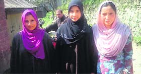 Najeeba (centre) seen with other first-time voters outside a polling booth in Budgam district on Wednesday.