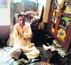 Bhushan Lal Shah sitting in his house at Habba Kadal locality at Srinagar on Wednesday.
