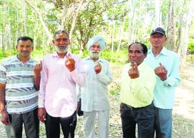 Upparla Malout village residents show their inked fingers after casting their vote