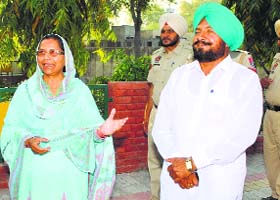 SADs Paramjit Kaur Gulshan and Congress Joginder Singh at the polling booth number 126 in Faridkot on Wednesday