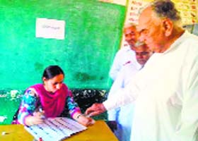 Veteran leader Bal Ram Jakhar (91) and his son Sunil Jakhar cast their vote in Abohar on Wednesday