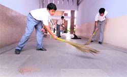 Students of St Johns High School, Sector 26, clean the corridors of the building on the occasion of Labour Day in Chandigarh on Thursday. Tribune Photo: Pradeep Tewari