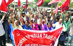 Members of the Centre of Indian Trade Unions participate in a May Day rally in Jammu on Thursday. Tribune photo: Inderjeet Singh