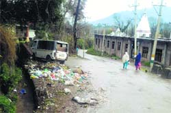 Garbage lies on a roadside in Poonch.