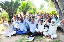 Members of National Mazdoor Conference protest for their demands at Rani Park in Jammu on Thursday. Tribune photo: Inderjeet Singh