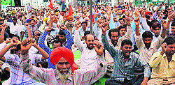 Members of the Northern Railway Men’s Union hold a rally at the Ludhiana railway station to mark May Day on Thursday