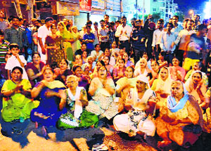 Congress workers protest at Gola Hatti Chowk in Amritsar on Friday.