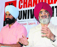 Chandigarh University VC RS Bawa (right) addresses mediapersons in Amritsar on Friday.