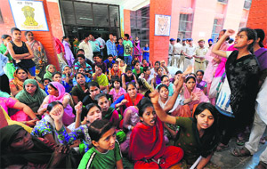 Students and their parents protest at Government Senior Secondary School, Dhanas, in Chandigarh on Friday.
