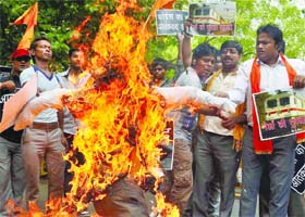 Activists of the Hindu Sena burn an effigy of terrorist during a demonstration to protest against the blasts in Chennai, at Jantar Mantar in New Delhi on Friday