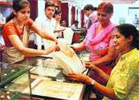 Customers at a jewellery shop on the occasion of Akshaya Tritiya in Jalandhar on Friday. Photo: Sarabjit Singh 