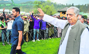 PDP patron Mufti Mohammad Sayeed waves towards party workers in Baramulla district on Friday. 