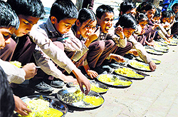 Children partake of rice and kadhi at a school in Ludhiana