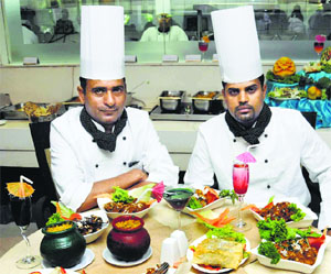 Chefs present Hyderabadi dishes.