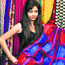 A model displays a saree