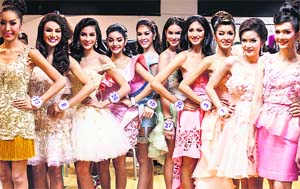 Beauty contestants pose for photographs backstage before the final of the annual Miss Tiffany's Universe 2014 transvestite contest in the beach resort town of Pattaya on Friday. Reuters 