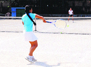 Players in action at the All India Ranking Tennis Tournament in Amritsar on Saturday.