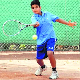 A player returns a shot during a tournament at DAV Senior Secondary School in Panchkula on Saturday