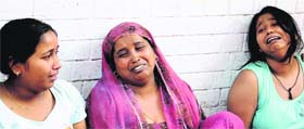 Victim Kirti’s inconsolable mother flanked by her elder sisters at their residence in Sector 19, Chandigarh, on Saturday