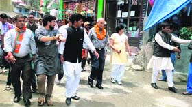 Senior BJP leaders conduct a roadshow in support of BJP MP candidate from Tehri parliamentary constituency in Nainbagh on Saturday.