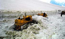 GREF personnel cut snow at the Rohtang Pass.