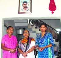 (From L) Sarabjits wife Sukhpreet, sister Dalbir and daughter Poonam in Bhikhiwind village on Saturday. Tribune photo