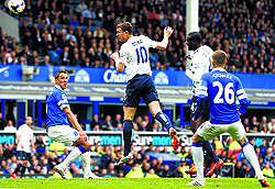 Edi Dzeko of Manchester City heads to score against Everton at Goodison Park in Liverpool on Saturday