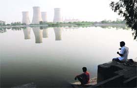 Placid waters: An angler sits on the bank of the Thermal Lake in Bathinda on Sunday