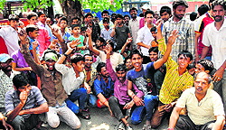 Residents of Colony No. 4 hold a protest in front of the police station in the Industrial Area, Phase I, Chandigarh, on Sunday