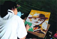A student participates in the All-India Inter School Painting Competition at Unison World School in Dehradun on Sunday. A Tribune photograph