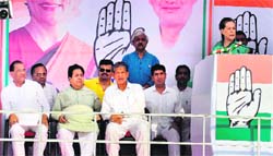 UPA Chairperson Sonia Gandhi addresses an election rally at Roorkee on Sunday. Chief Minister Harish Rawat is also seen in the picture. Tribune photo:Rameshwar Gaur