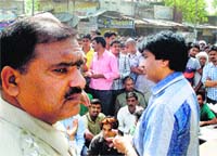 SDM Satish Yadav pacifies villagers at Kanina in Mahendragarh on Sunday. Photo by writer