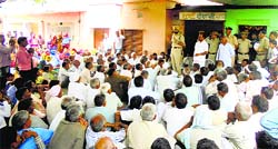 SP Simardeep Singh interacts with villagers during a panchayat in Bucholi village of Mahendragarh on Sunday. Photo: Ravinder Saini