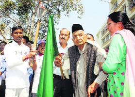 Roshan Lal Vohra flags off a marathon race in Chamba on Sunday.