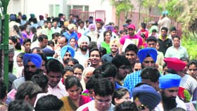 Students come out of an examination centre in Jalandhar on Sunday