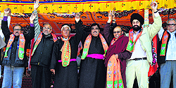 Former BJP president Nitin Gadkari with Thuptsan Chhewang (left), BJP candidate for the Ladakh seat, during a public rally in Leh on Sunday