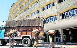 Workers unload official documents at the civil secretariat in Srinagar as part of the biannual Durbar Move exercise