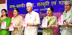 The book titled Clean Chit written by Yogita Yadav (extreme left) being released at KL Sehgal Hall in Jammu