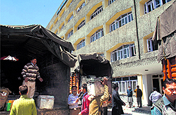 Workers unload official documents at the civil secretariat during the Durbar Move in Srinagar