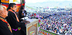 BJP leader Nitin Gadkari addresses a rally in Leh on Sunday as party candidate Thuptsan Chhewang for the Ladakh constituency stands beside him
