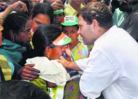 Congress vice-president Rahul Gandhi talks to women during an election campaign at Tikermafi in Amethi on Sunday