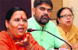 Senior BJP leader Uma Bharati addresses mediapersons in Dehradun on Monday.