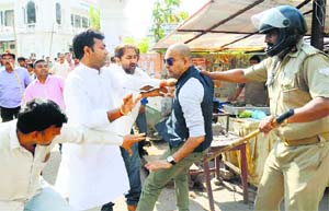 The violent way: Workers of the Bundelkhand Vikas Sena protest against the Congress manifesto in Lucknow.