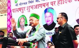 CM Virbhadra Singh addresses a Congress rally in Palampur on Monday