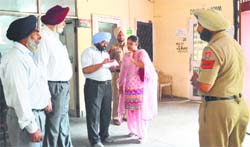 Mayor Harcharan Singh Gohalwaria (second from left), conducts a surprise check at the Zone A office of the MC in Ludhiana on Monday. Tribune photo